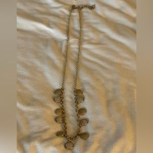 Chico’s long necklace with brushed gold and brushed gold/Rinestone pendants.